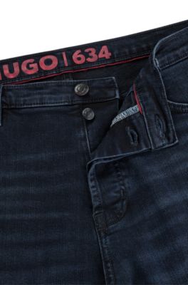 HUGO - Tapered-fit jeans in blue-black denim