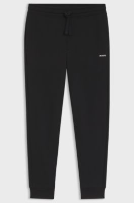 Cuffed tracksuit bottoms in cotton terry with logo print, Black