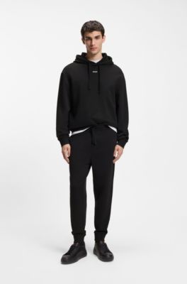 Cuffed tracksuit bottoms in cotton terry with logo print, Black