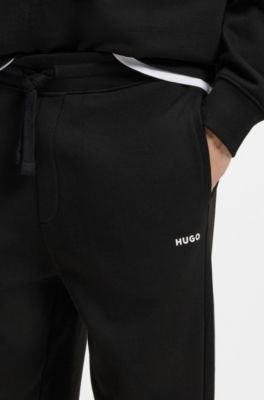 Cuffed tracksuit bottoms in cotton terry with logo print, Black