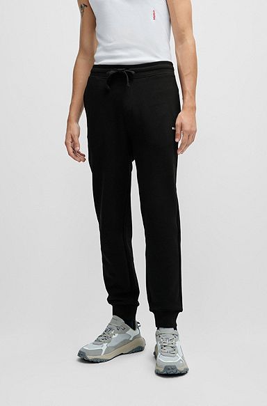 Pantaloni della tuta in terry di cotone con logo stampato, Nero
