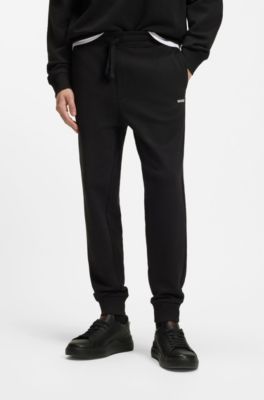 Cuffed tracksuit bottoms in cotton terry with logo print, Black