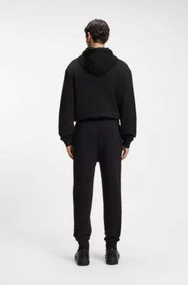 Cuffed tracksuit bottoms in cotton terry with logo print, Black