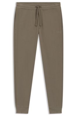Cuffed tracksuit bottoms in cotton terry with logo print, Brown