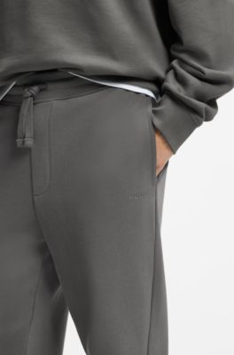 Cuffed tracksuit bottoms in cotton terry with logo print, Grey