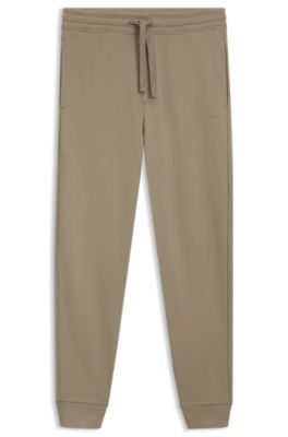 Cuffed tracksuit bottoms in cotton terry with logo print, Brown