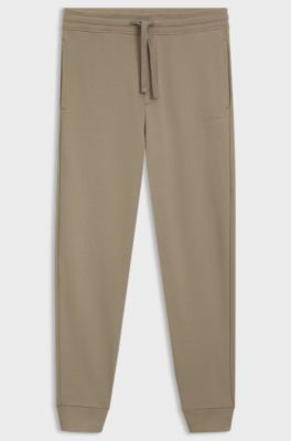 Cuffed tracksuit bottoms in cotton terry with logo print, Brown