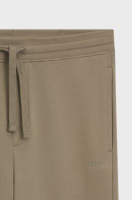 Cuffed tracksuit bottoms in cotton terry with logo print, Brown