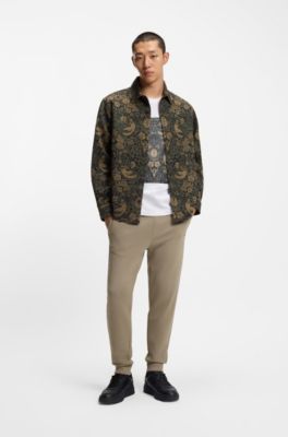 Cuffed tracksuit bottoms in cotton terry with logo print, Brown