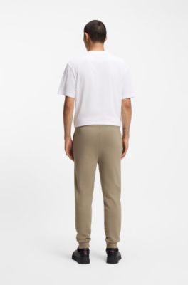 Cuffed tracksuit bottoms in cotton terry with logo print, Brown