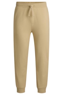 Cuffed tracksuit bottoms in cotton terry with logo print, Light Beige