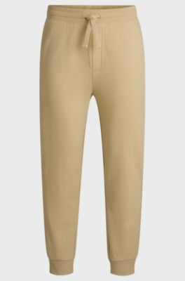 Cuffed tracksuit bottoms in cotton terry with logo print, Light Beige