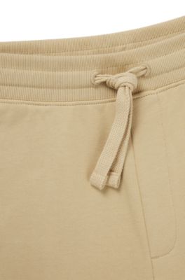 Cuffed tracksuit bottoms in cotton terry with logo print, Light Beige