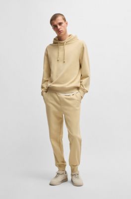 Jogginghose aus Baumwoll-Terry mit kontrastfarbenem Logo, Hellbeige