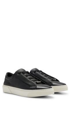 - Leather trainers with branded