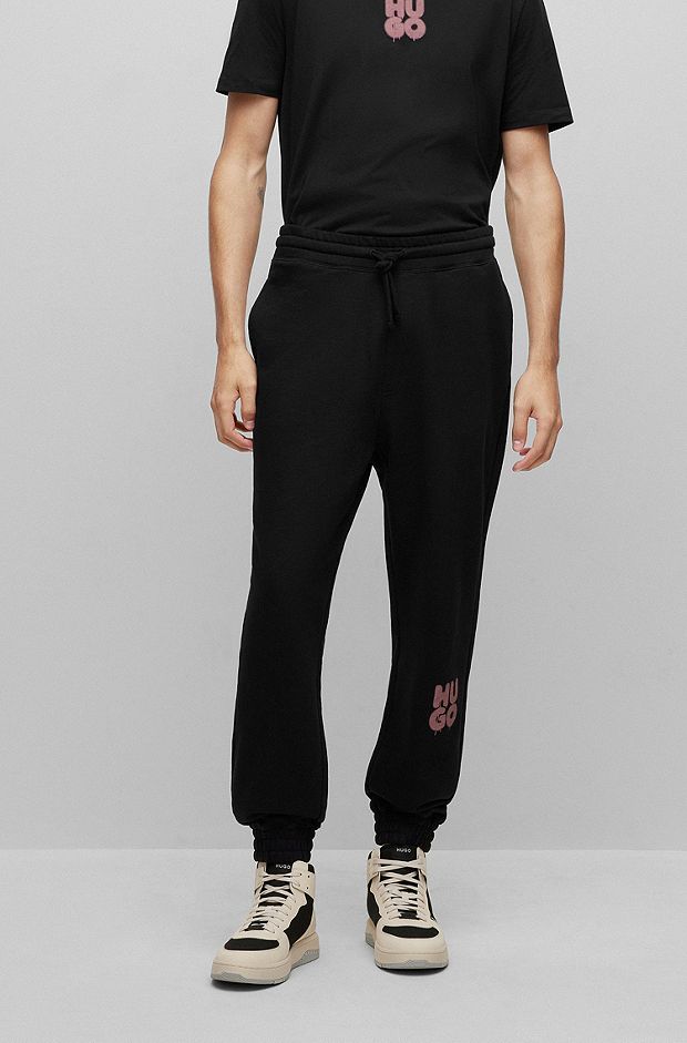 Cotton-terry tracksuit bottoms with graffiti-style logo, Black