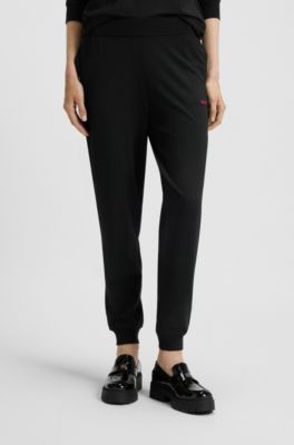 Logo-print tracksuit bottoms in stretch modal and cotton, Black