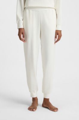 Logo-print tracksuit bottoms in stretch modal and cotton, Natural