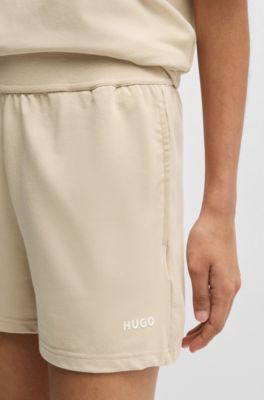Shorts van stretchmateriaal met logoprint, Lichtbeige
