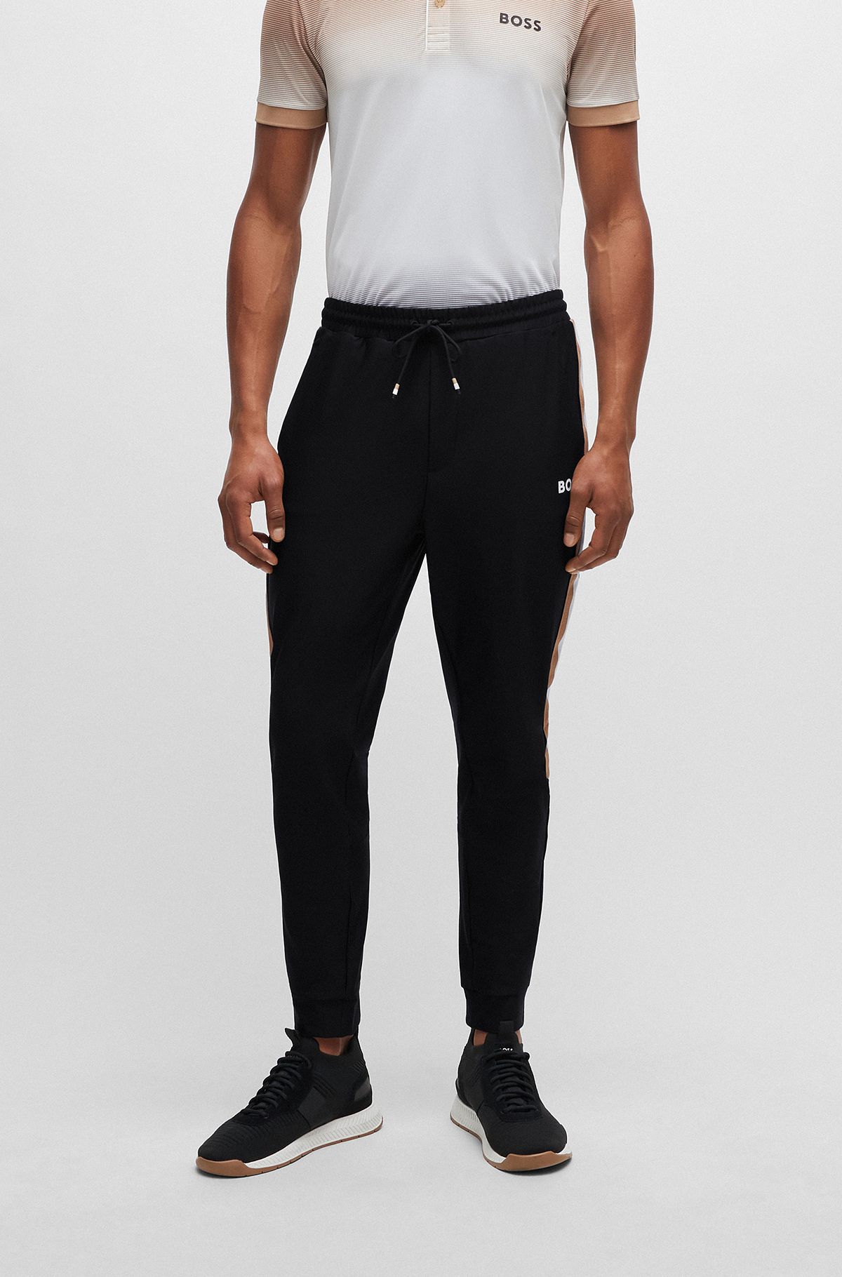 BOSS x Matteo Berrettini Tracksuit bottoms in active-stretch fabric with side stripes, Black