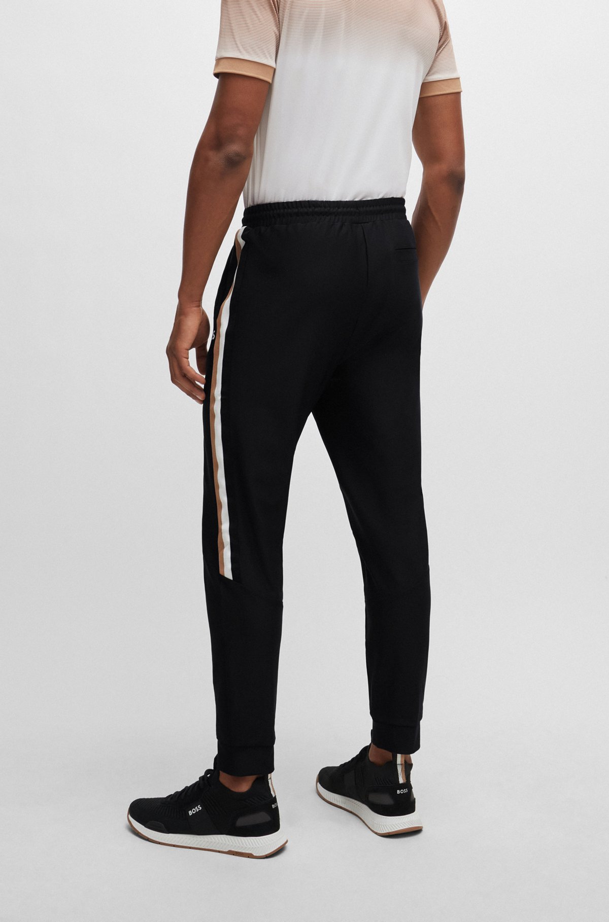 Stretch-jersey tracksuit bottoms with signature-stripe tape, Black