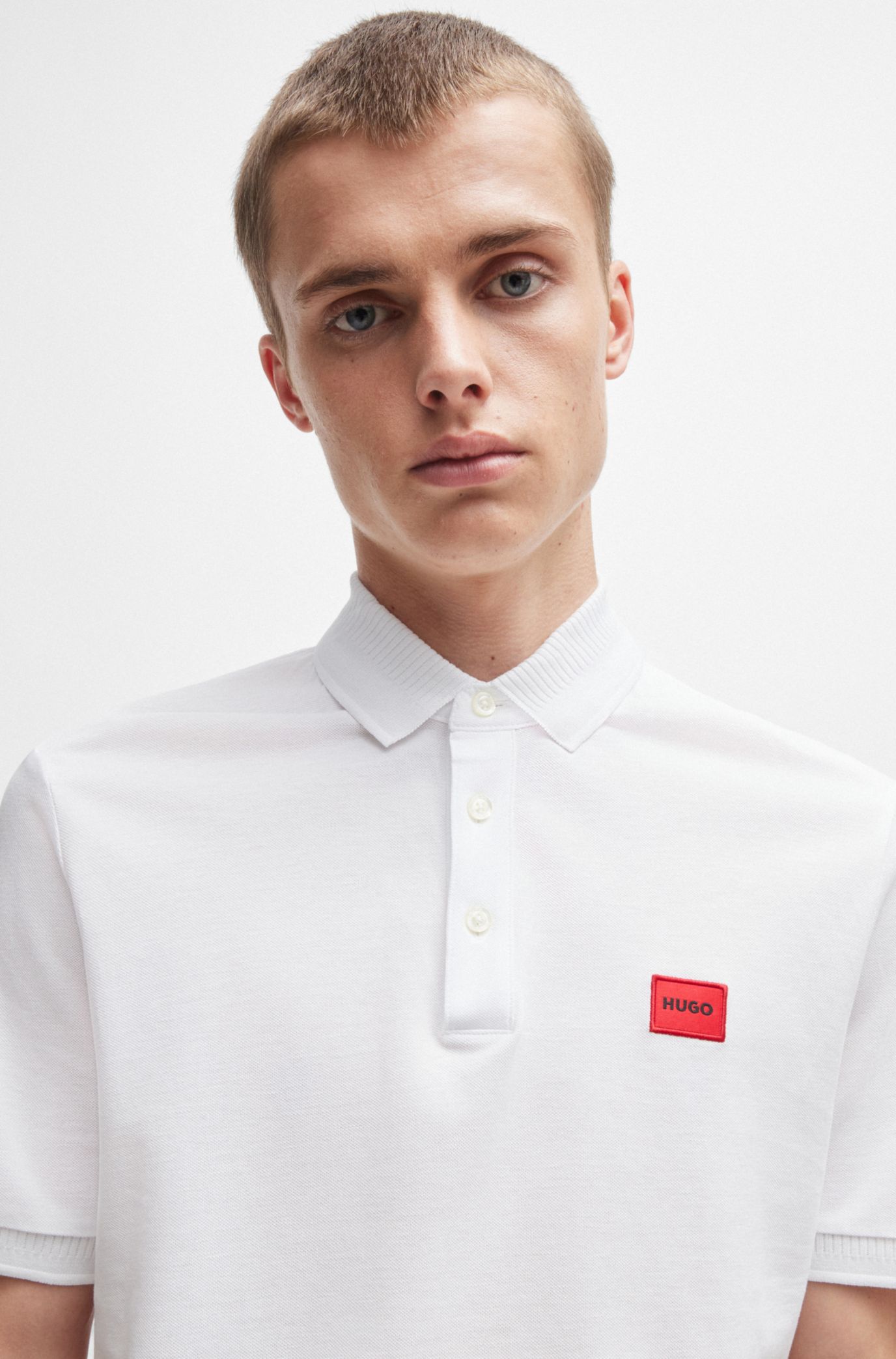 HUGO - Cotton-piqué slim-fit polo shirt with red logo label