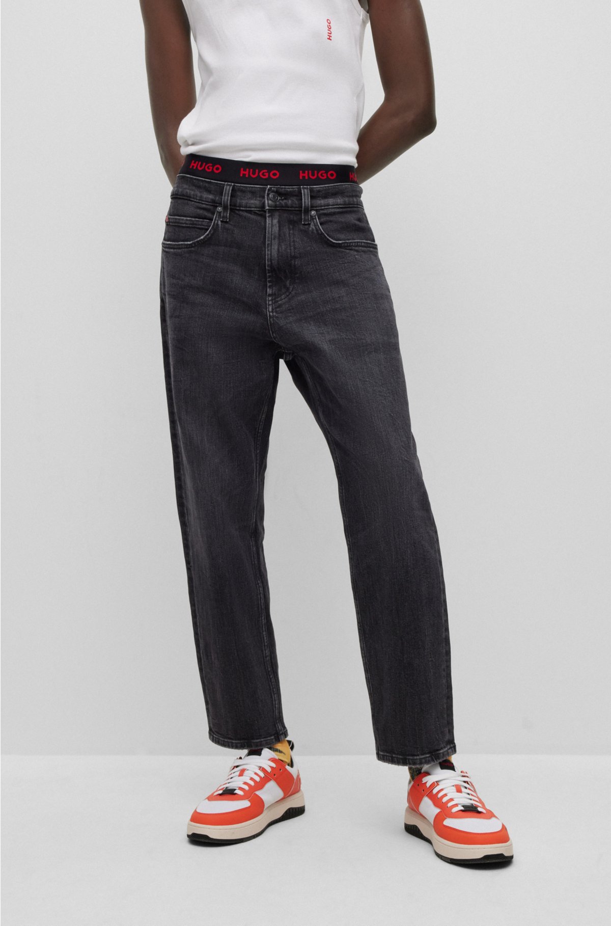 HUGO - Regular-fit black comfort-stretch jeans in denim