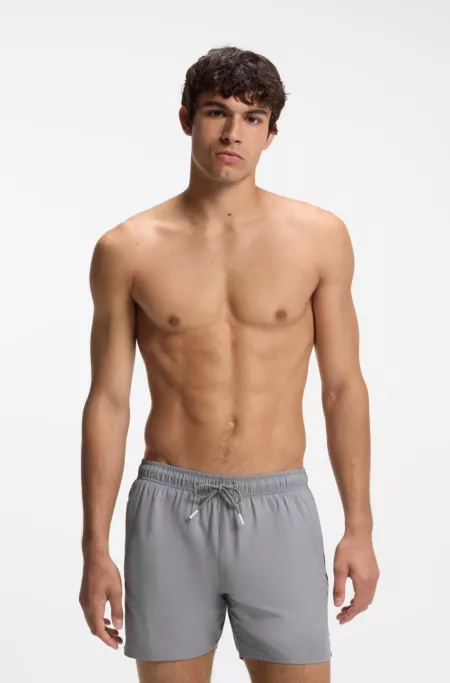 Swim shorts with signature stripe and logo