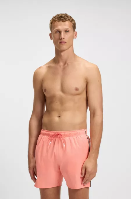 Short de bain avec rayures emblématiques et logo