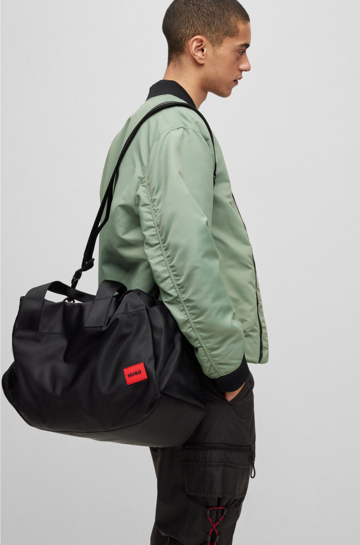 Holdall in matte fabric with red logo label, Black