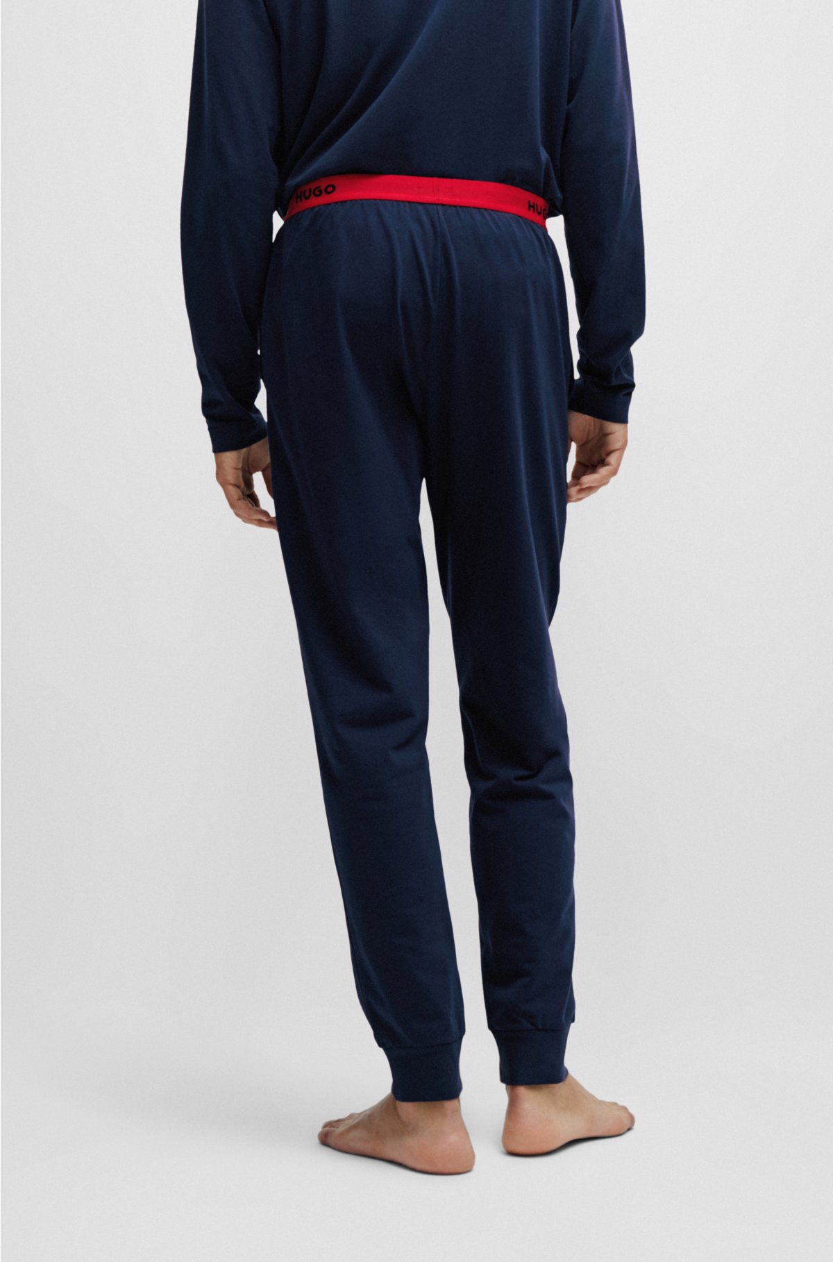 Homme Pantalon d’intérieur en coton stretch resserré au bas des jambes,  avec logo brodé Bleu | Vêtements de nuit et vêtements d’intérieur HUGO BOSS  <