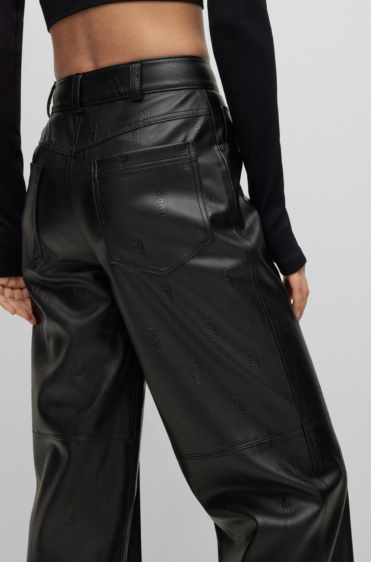 Logo-embossed relaxed-fit HUGO leather faux trousers in -