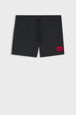 Quick-drying swim shorts with red logo label, Black