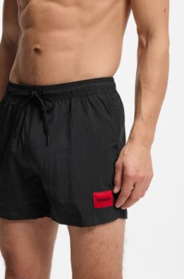 Quick-drying swim shorts with red logo label, Black