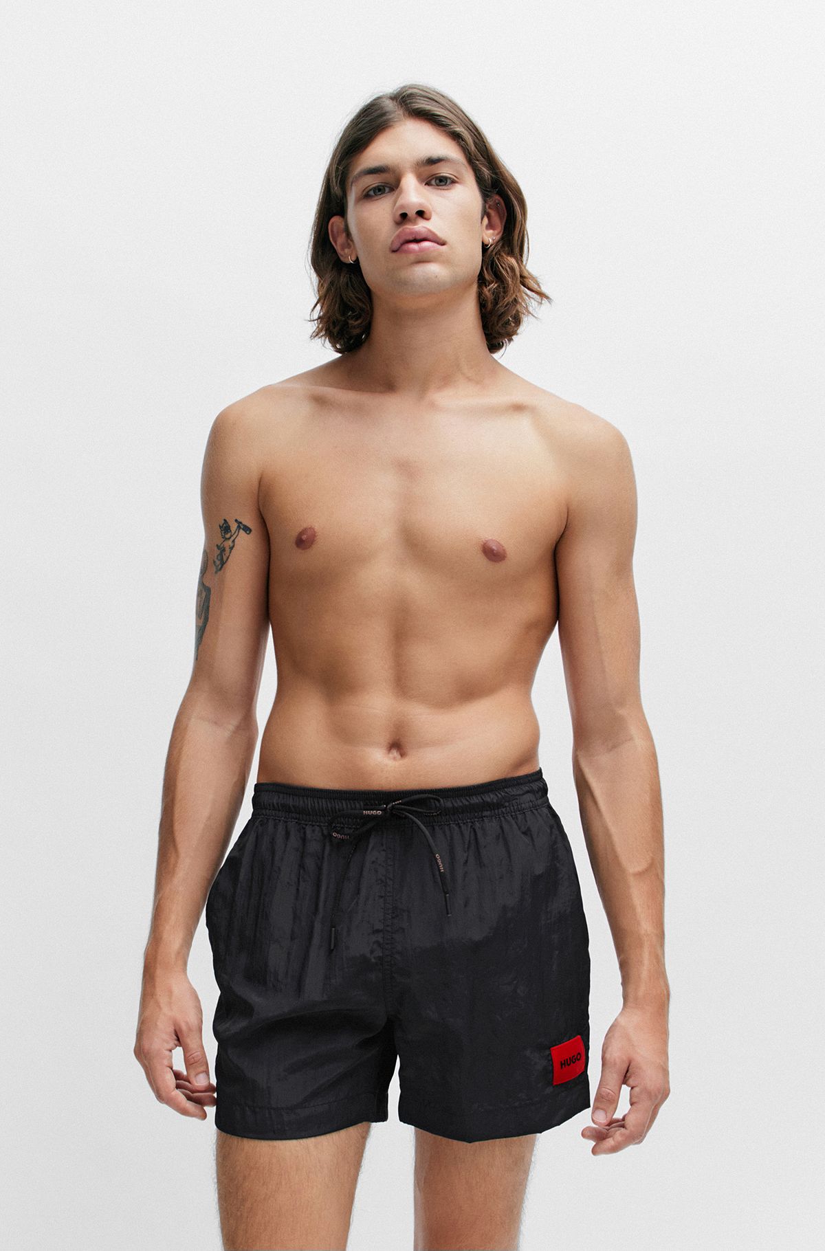 Fully lined swim shorts with red logo label, Black