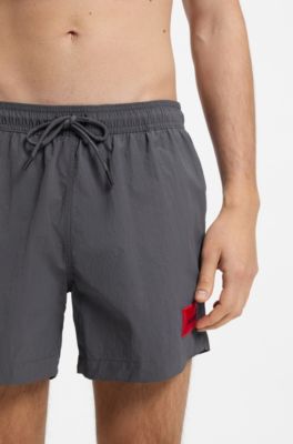 Quick-drying swim shorts with red logo label, Dark Grey