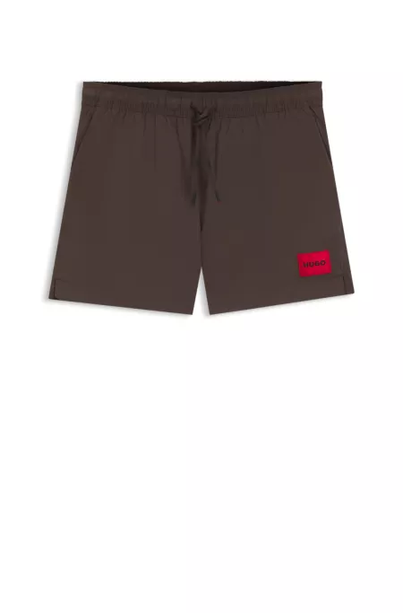 Quick-dry swim shorts with logo label