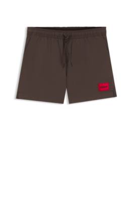 Quick-drying swim shorts with red logo label 1