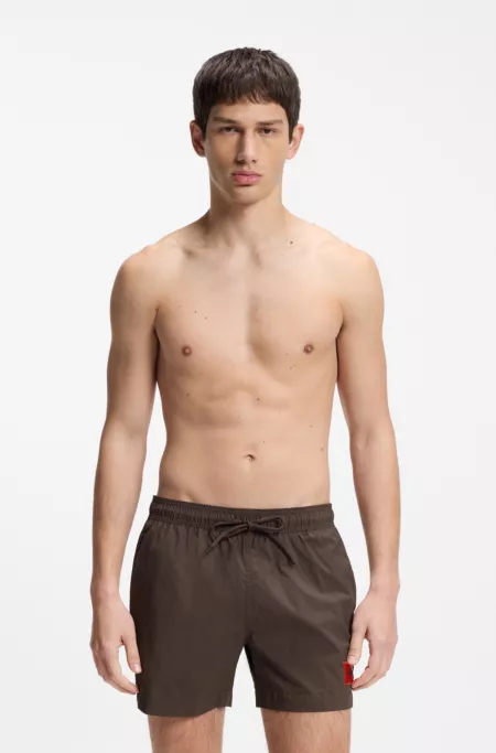 Quick-dry swim shorts with logo label