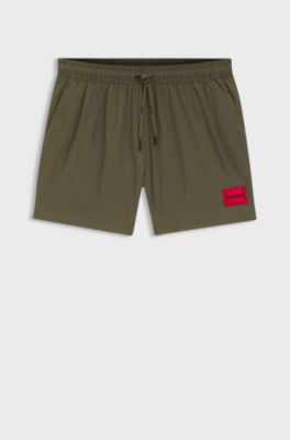 Quick-drying swim shorts with red logo label, Dark Green