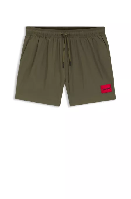 Swim shorts with logo label