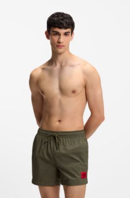 Quick-drying swim shorts with red logo label, Dark Green