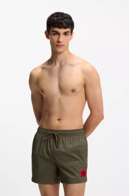 Quick-dry swim shorts with logo label