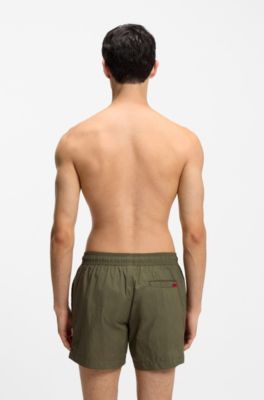 Quick-drying swim shorts with red logo label, Dark Green