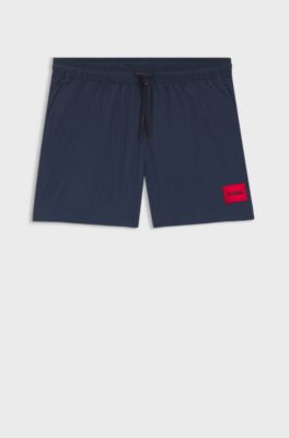 Quick-drying swim shorts with red logo label, Dark Blue