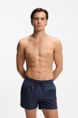 Quick-drying swim shorts with red logo label, Dark Blue