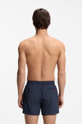 Quick-drying swim shorts with red logo label, Dark Blue