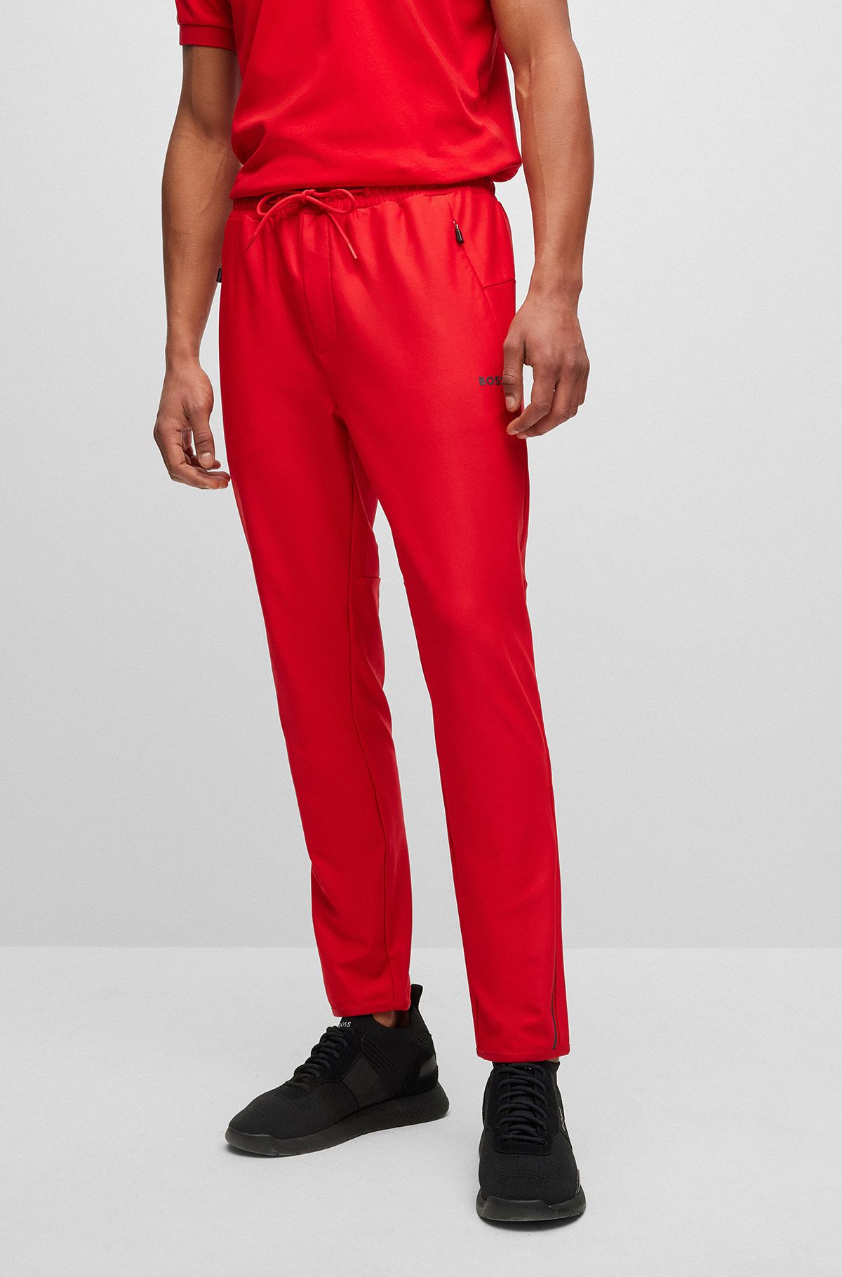 Regular-fit tracksuit bottoms with decorative reflective pattern, Red