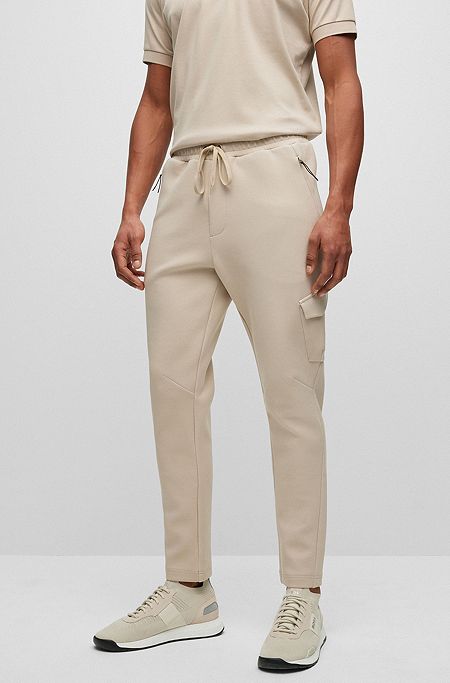 Advanced-stretch cotton-blend tracksuit bottoms with zipped pockets, Beige