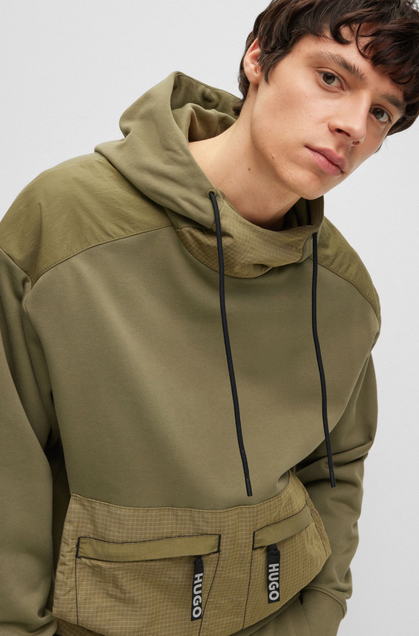 HUGO - Relaxed-fit hoodie with ribbed cuffs in mixed materials